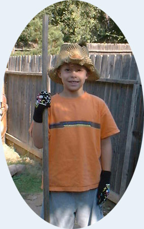 Cleaning the side yard with his new hat...